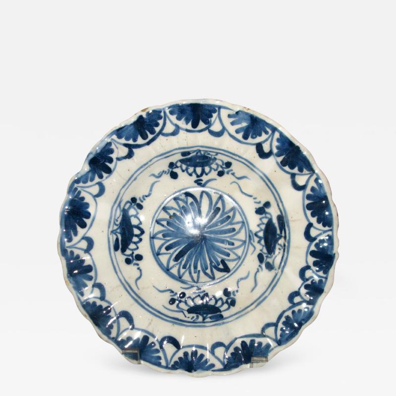 A Blue and White Delft Charger with Floral Splays and Scalloped Edge