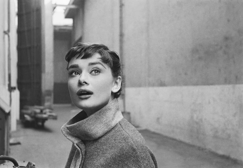 Mark Shaw Mark Shaw AUDREY HEPBURN IN GREY TURTLENECK SWEATER LOOKING UP 1953