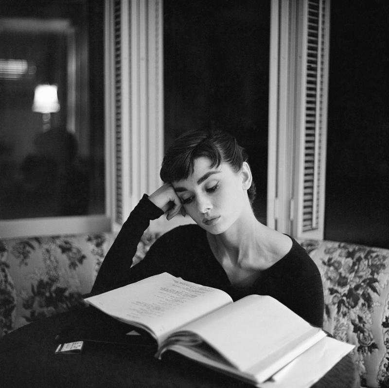 Mark Shaw Mark Shaw AUDREY HEPBURN SUPINE READING SITTING UP 1953