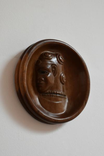 Africanist low relief round wooden wall sculpture 1970s 
