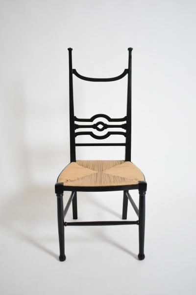 Arts Crafts ebonised wood fireside chair 1900s 