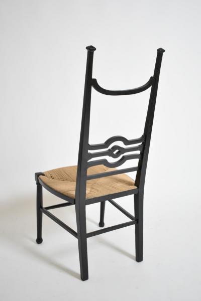 Arts Crafts ebonised wood fireside chair 1900s 