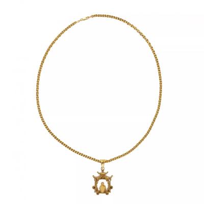 Gold Necklace With A Pagoda Pendant Featuring A Meditating Buddha 