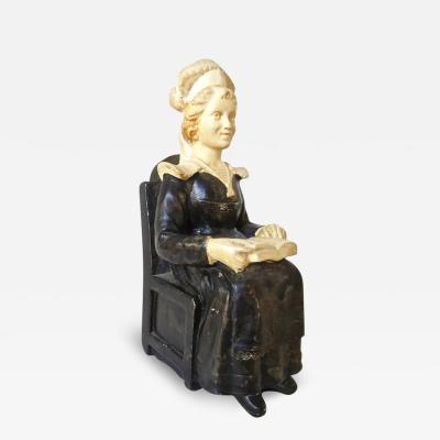 Lady Seated in Chair Reading Money Box or Still Bank by a Biagioni circa 1925