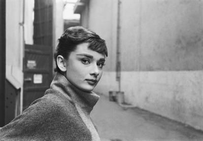 Mark Shaw Mark Shaw AUDREY HEPBURN IN GREY TURTLENECK SWEATER GLANCES RIGHT 1953