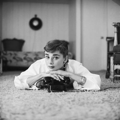 Mark Shaw Mark Shaw AUDREY HEPBURN IN WHITE BLOUSE WITH PHONE LAYING CHIN RESTING 1953