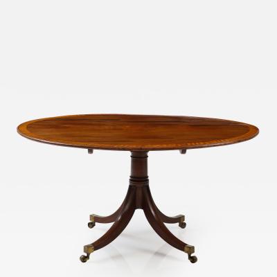 Oval mahogany breakfast table banded in satinwood 