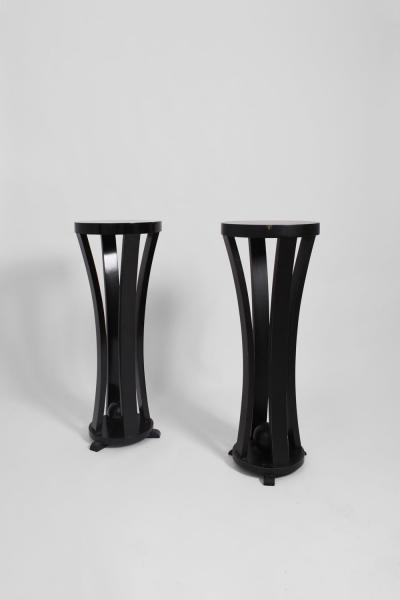 Pair of round black lacquered wooden pedestal tables 1960s 