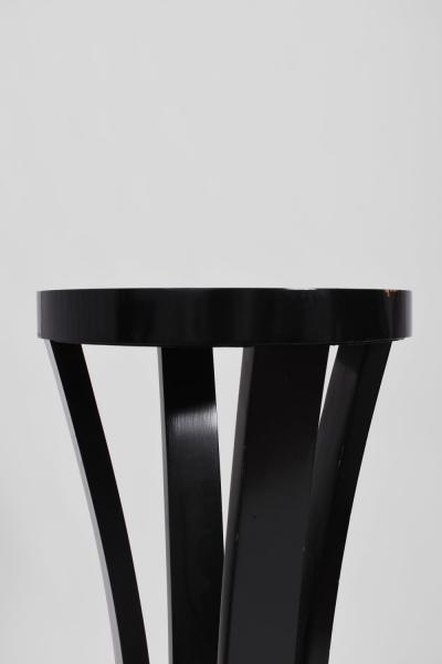 Pair of round black lacquered wooden pedestal tables 1960s 
