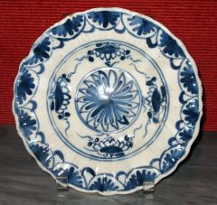 A Blue and White Delft Charger with Floral Splays and Scalloped Edge - 307556