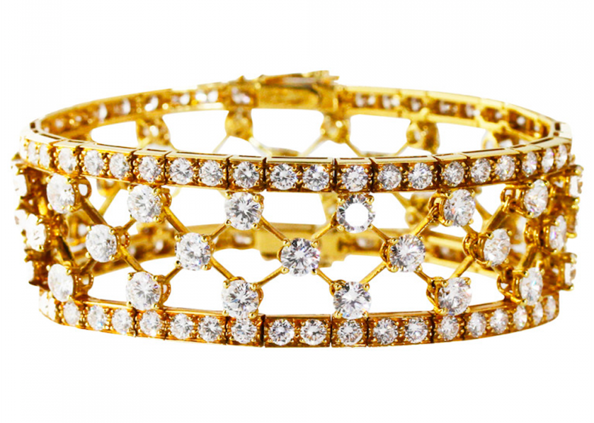 18 karat yellow gold 'snowflake' bracelet by Van Cleef & Arpels, designed as an openwork lattice design set with 144 round diamonds weighing approximately 25.00 carats, gross weight 46.9 grams, length 7 inches, width 7/8 inch, signed Van Cleef & Arpels, with French assay marks. Offered by J.S. Fearnley.