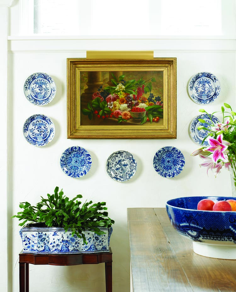 The blue and white ceramics are all Dutch Delft, with one exception: the late-eighteenth-century, transfer-decorated English pearlware punch bowl, which measures about twenty inches across. The focal point of this corner of the kitchen is Summer, an oil on canvas measuring 15ƒ x 24˙ inches, by George Henry Hall (1825– 1913), which he signed and dated 1870. One of his studies of the four seasons, it was purchased from Hirschl & Adler Gallery in New York. The Delft bowl in the foreground of the still life captivated the interest of the collectors: the painting marries two of their great passions.